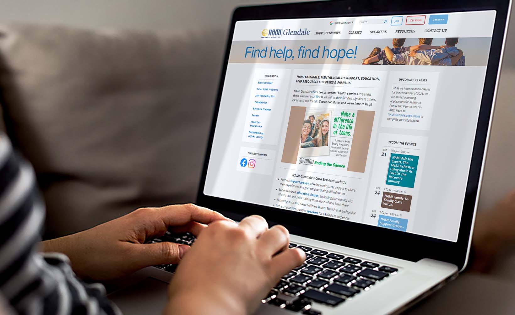Woman mindfully reading over the homepage of NAMI Glendale on her laptop